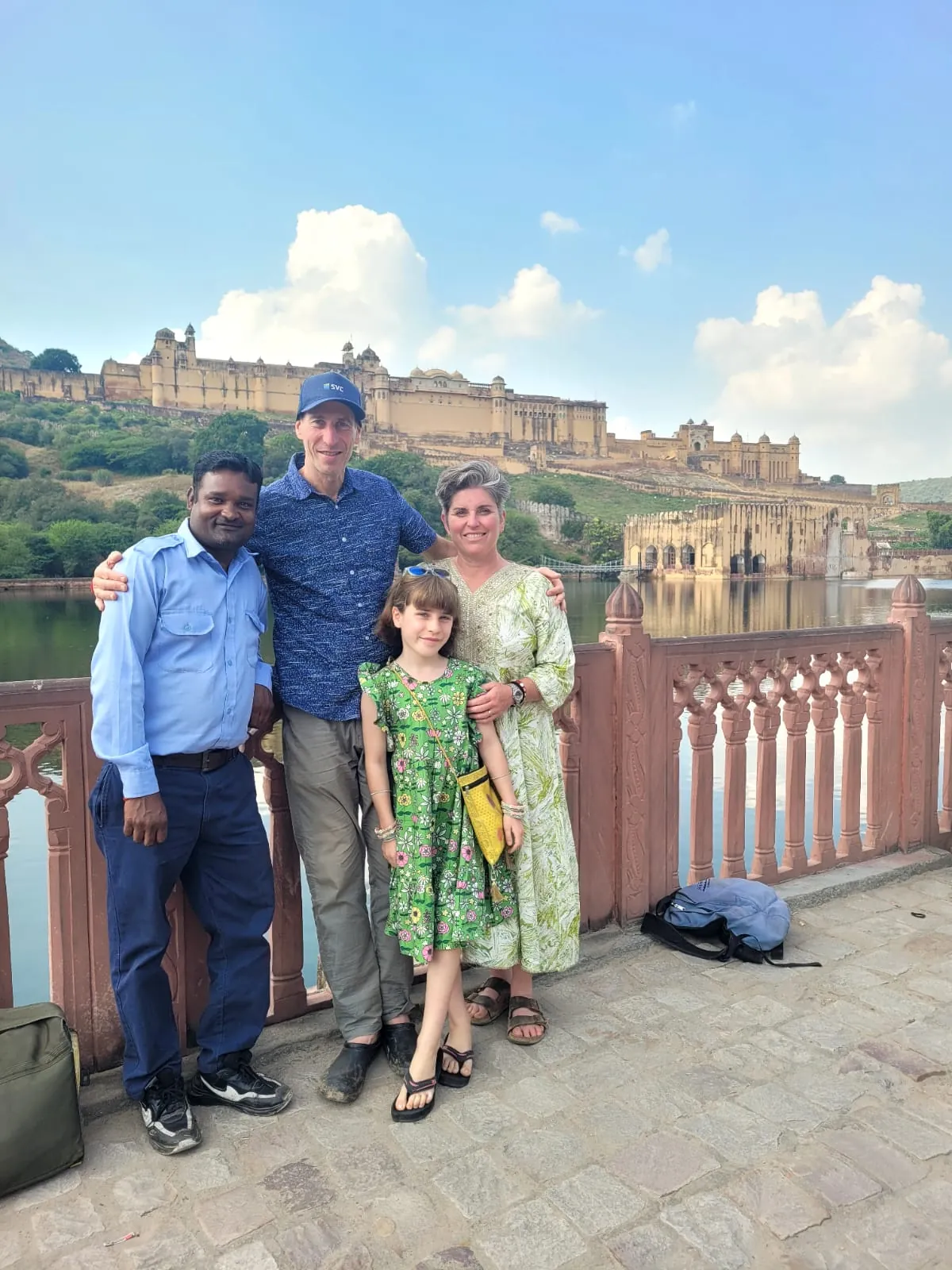 Travellers with a local guide overlooking Amber Fort during a private Jaipur sightseeing tour