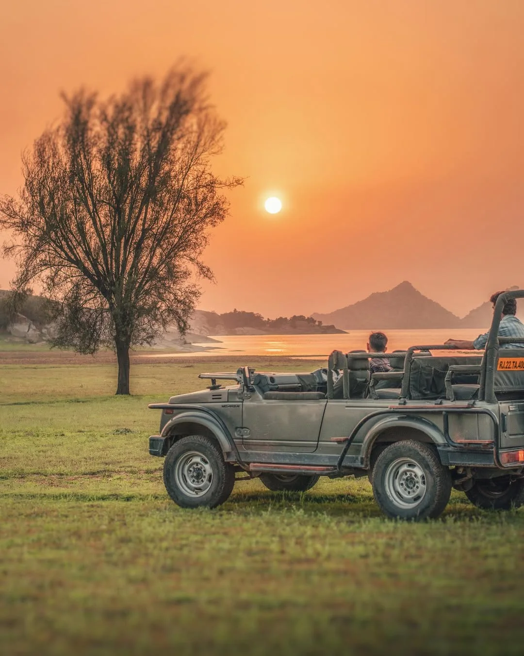 Open safari jeep overlooking Jawai Bandh and its granite hills