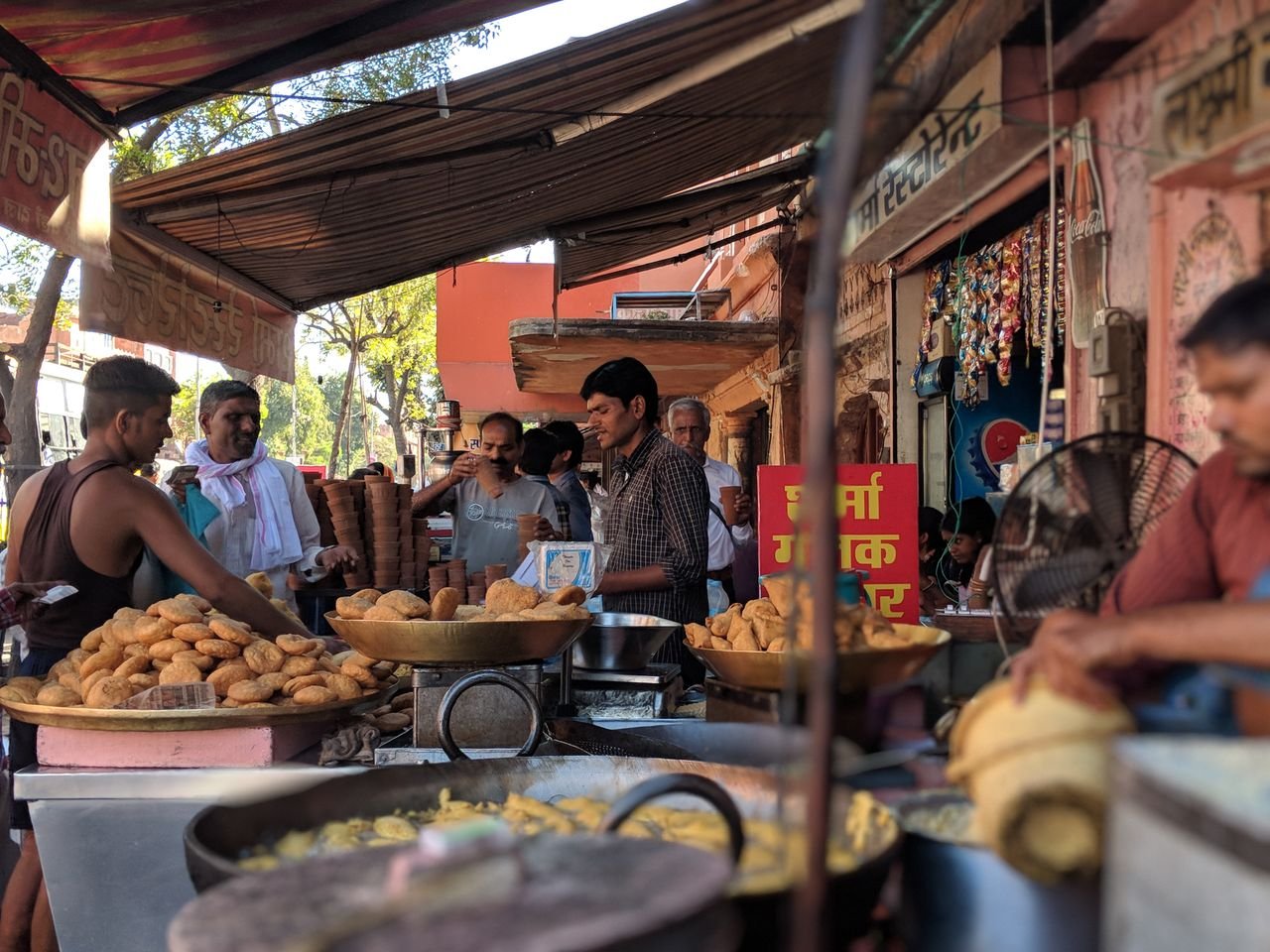 Visitor browsing traditional snacks at a Jaipur street food shop