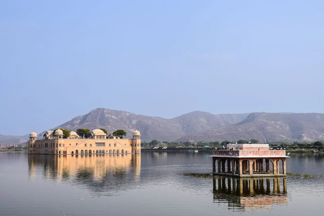 Jal Mahal and a lakeside pavilion reflected in Man Sagar Lake in Jaipur
