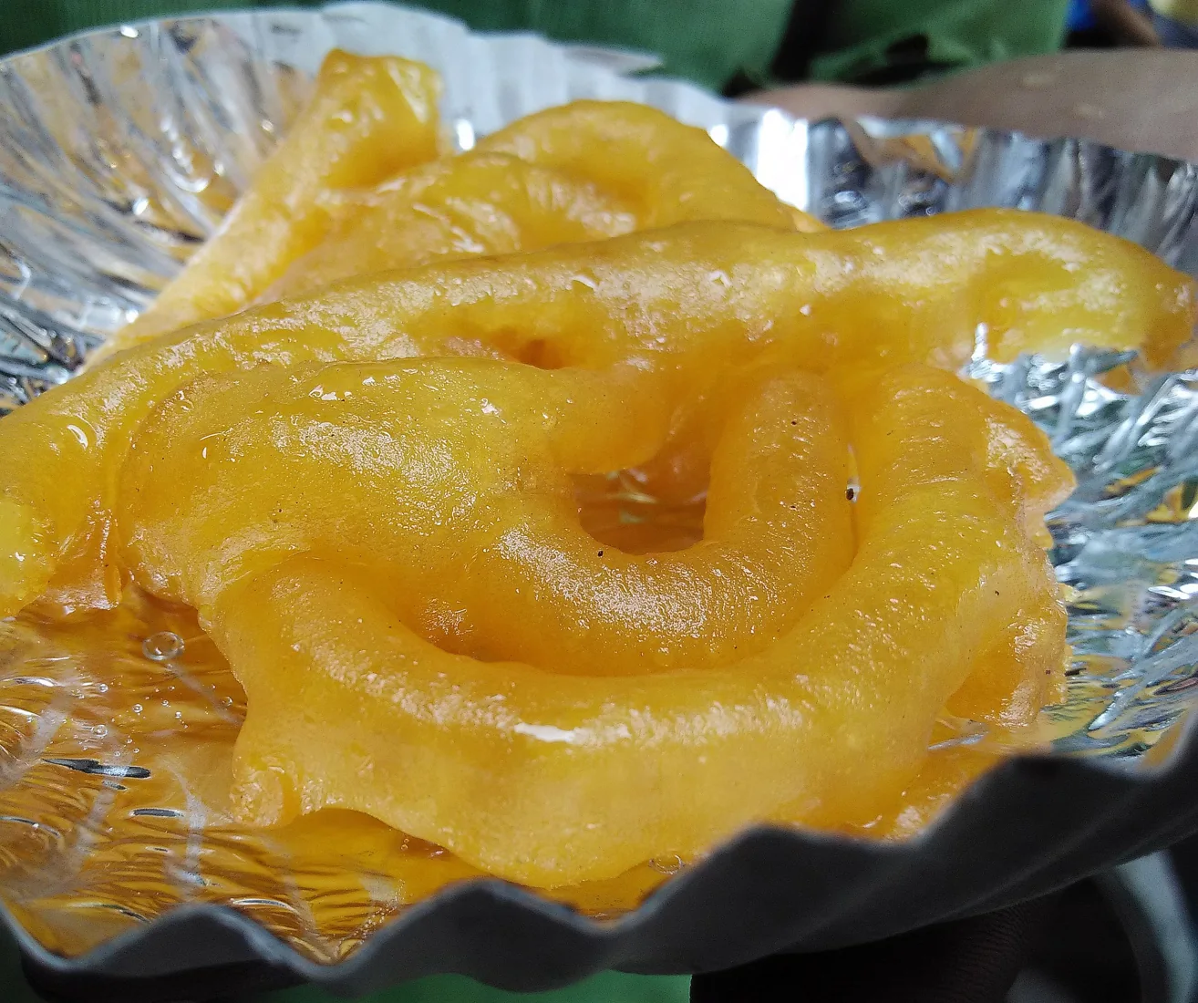Jalebi served on a foil plate at a sweet shop in Chandni Chowk