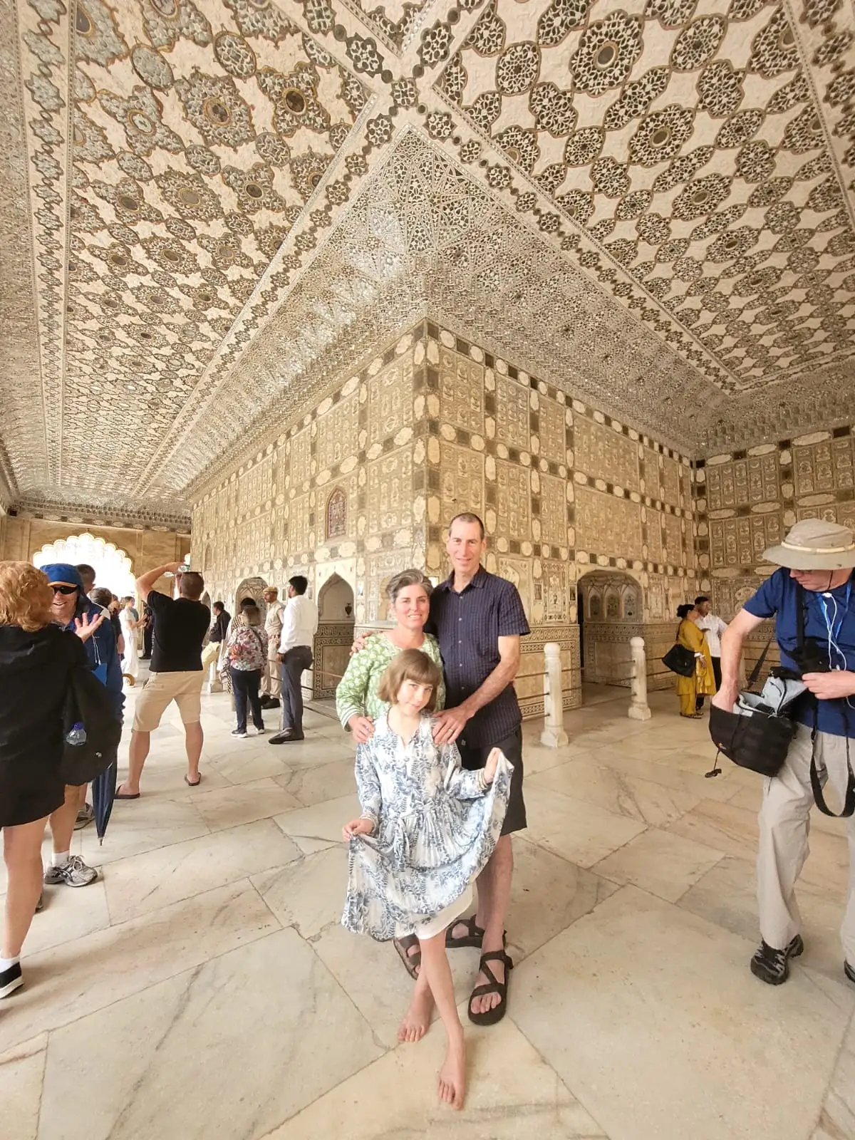 Family visiting the mirrored Sheesh Mahal inside Amber Fort