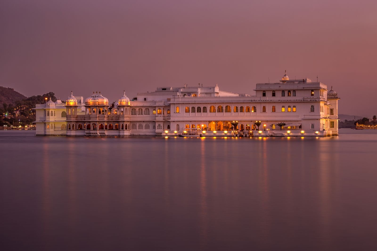Illuminated Lake Palace on Lake Pichola at dusk