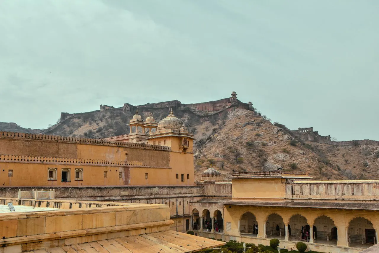 Amber Fort courtyard with Jaigarh Fort on the hill above