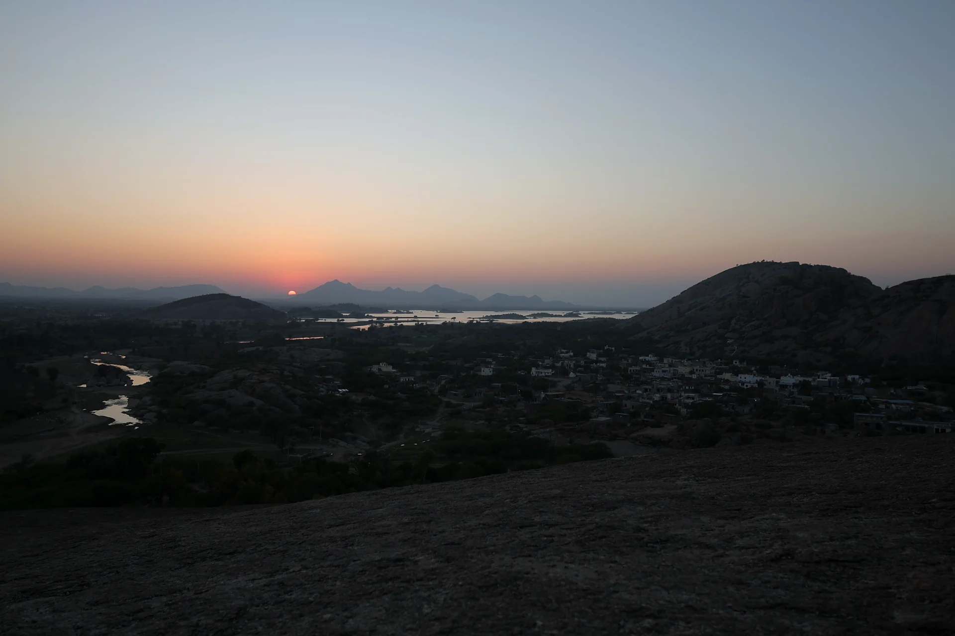 Sunset over Jawai’s granite hills and reservoir in Rajasthan