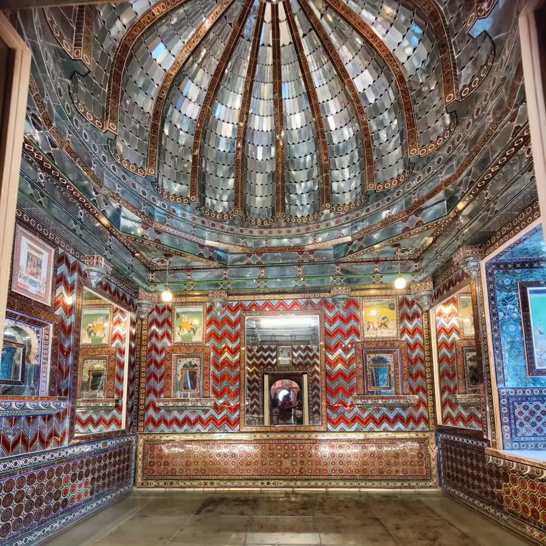 Ornate mirror-work interior of Sheesh Mahal at Amber Fort