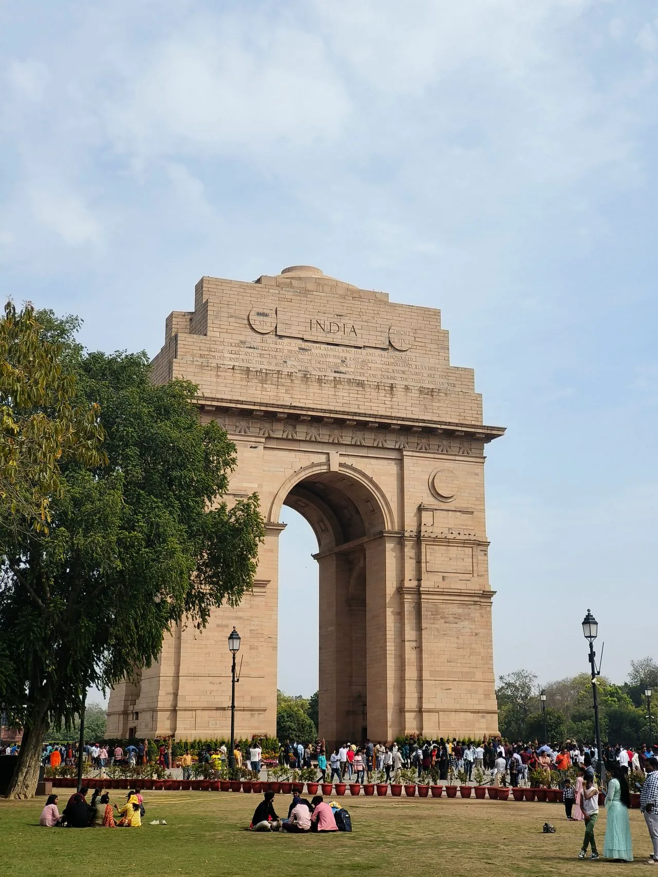 India Gate monument and visitors in New Delhi