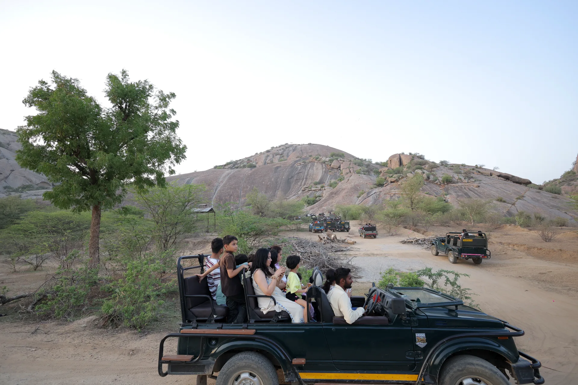 Travellers exploring Jawai’s granite landscape by open jeep