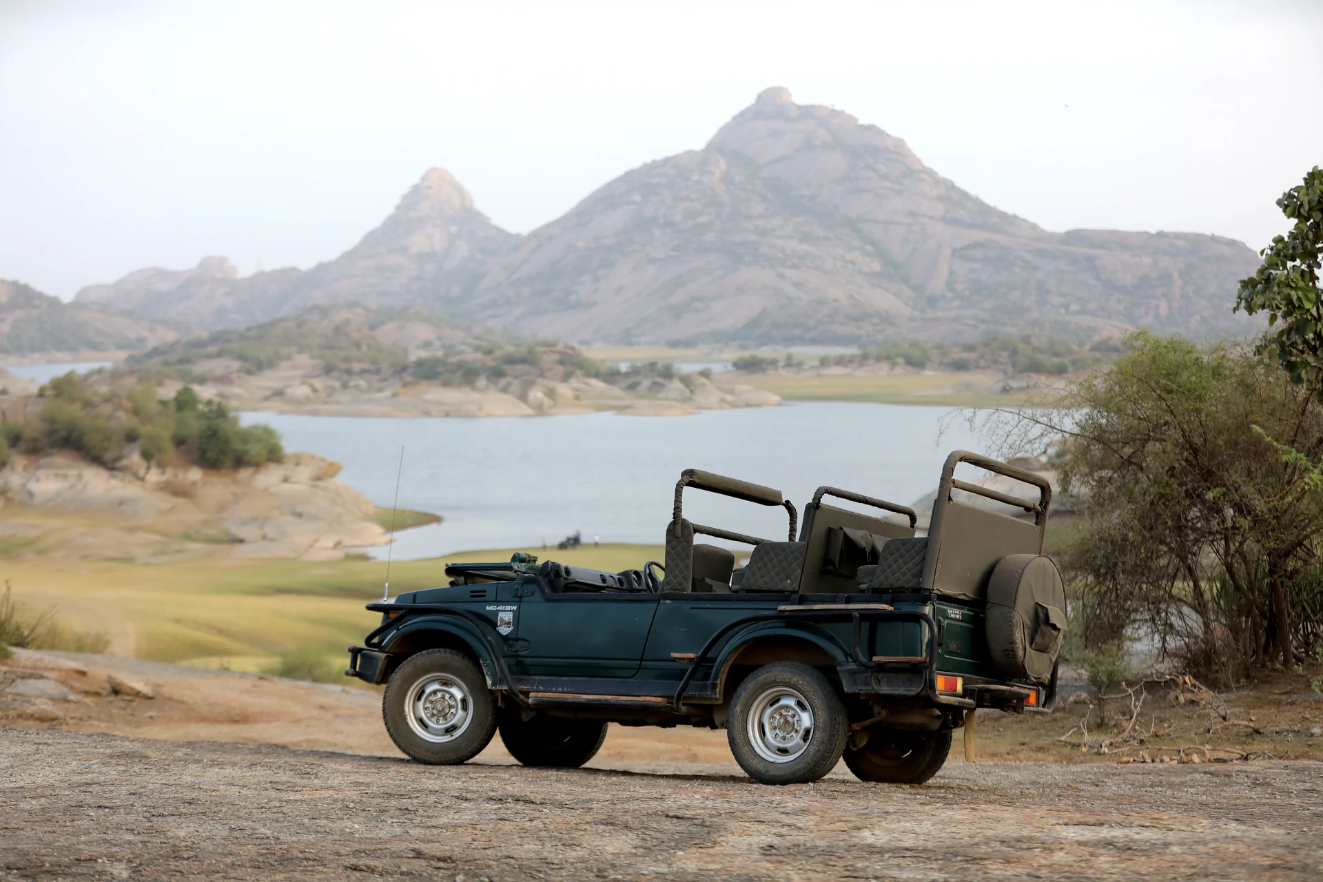 Open safari jeep overlooking Jawai Bandh and the granite hills