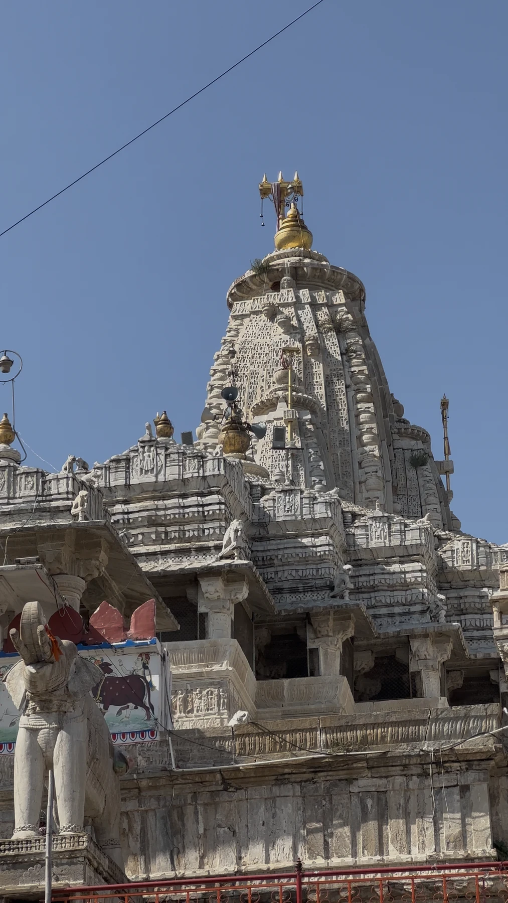 Ornately carved stone tower and pillars of Jagdish Temple in Udaipur